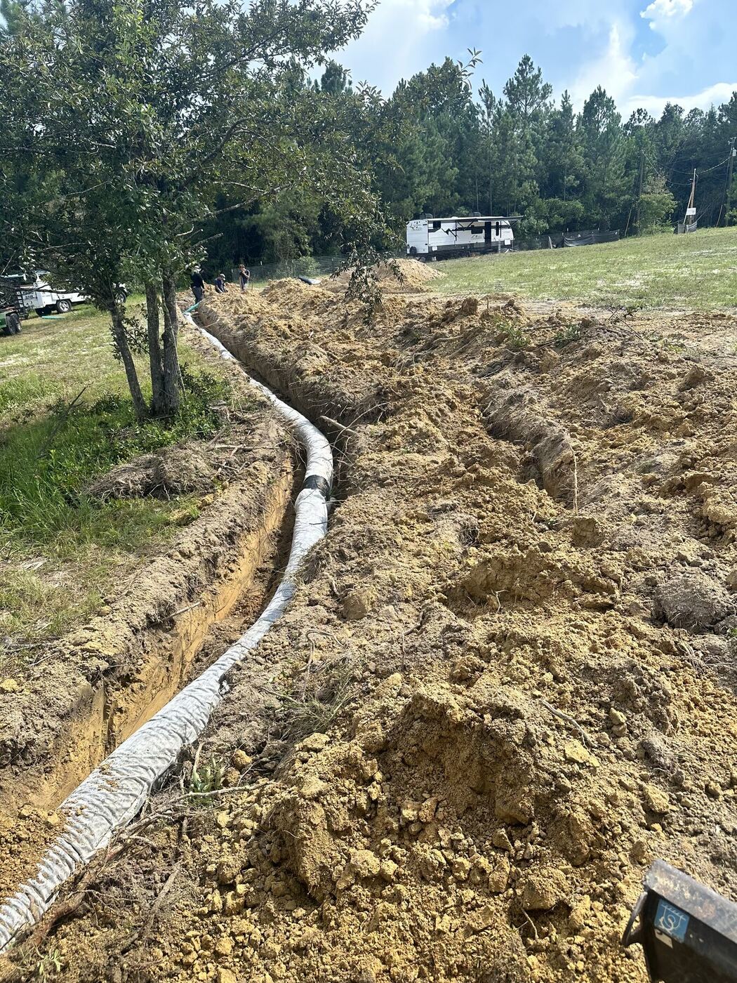 Septic field line installed in an excavated trench