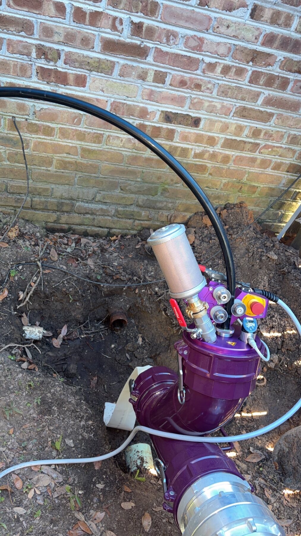 Quick Rooter UV-cured pipe rehabilitation equipment operating at an underground sewer line