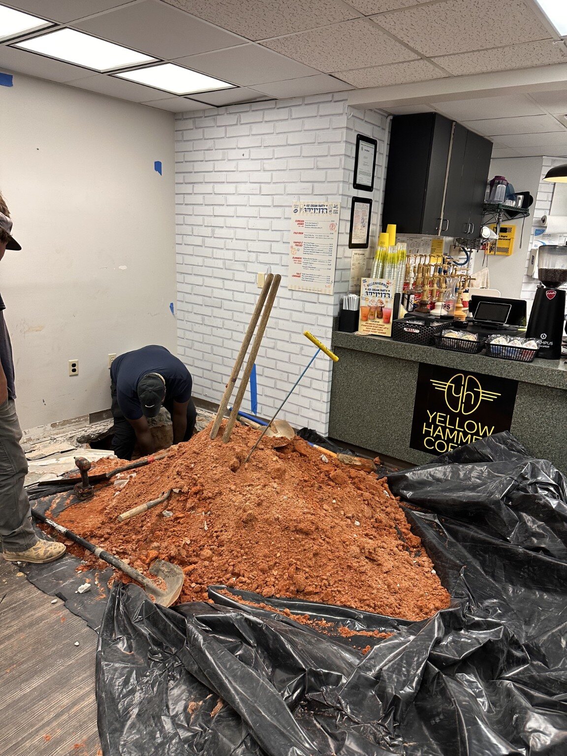 Protected commercial work area during underground plumbing repair