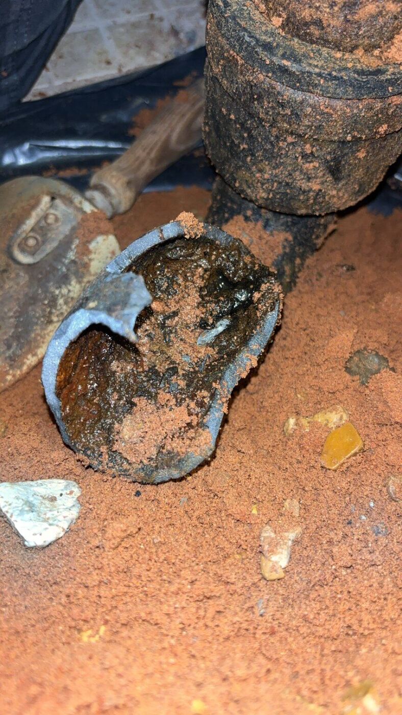 Failed drain pipe section removed during an under-slab repair
